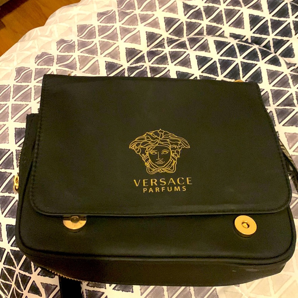 Versace crossbody bag used it a lot very comfortable. Still life left.